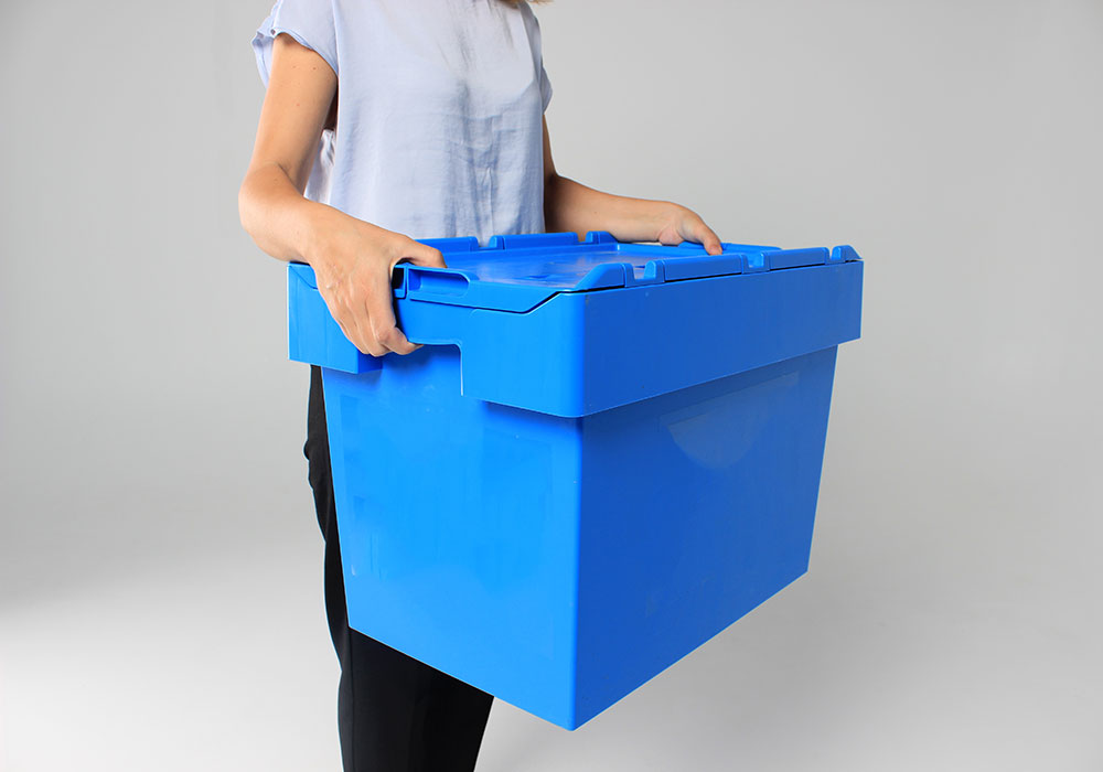 Woman packing up business into crates